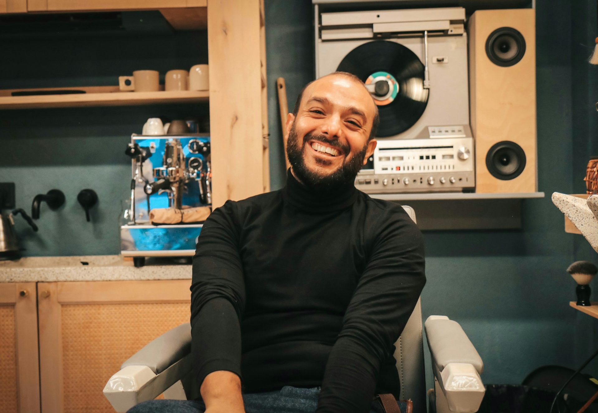 Happy man visiting barbershop